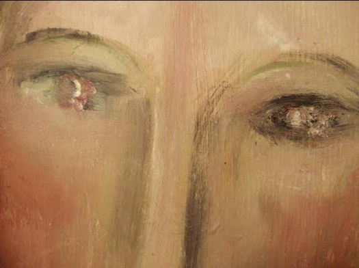 Dettaglio degli occhi e del naso nel Ritratto di ragazza in rosso di Modigliani. Volto stilizzato con tratti marcati, tipici della fase pre-scultorea.